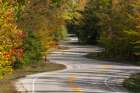 USA, Wisconsin. Curvy road in Door County in autumn. Art Print